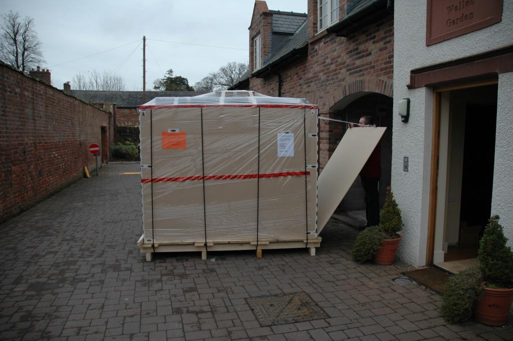 The new Deltec tank arrives on the purpose made pallet direct from Germany. The tank is crated already on its stand so that it can be positioned as a single unit.