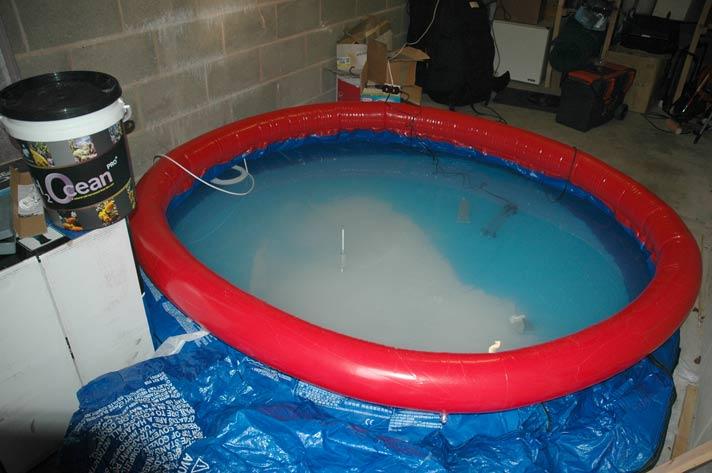 I used a kids swimming pool to make 2000 lts of water. I later regretted this as the resultant water had a slight smell and I was concerned about leaching from the plastic. I ran lots of carbon and it does not seem to have been a problem but I would not necessarily do it again.