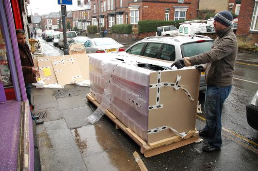 Opening the crate containing the cabinet